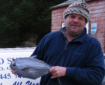 Ian McWhinney and the Ray's bream found in Badachro harbour.